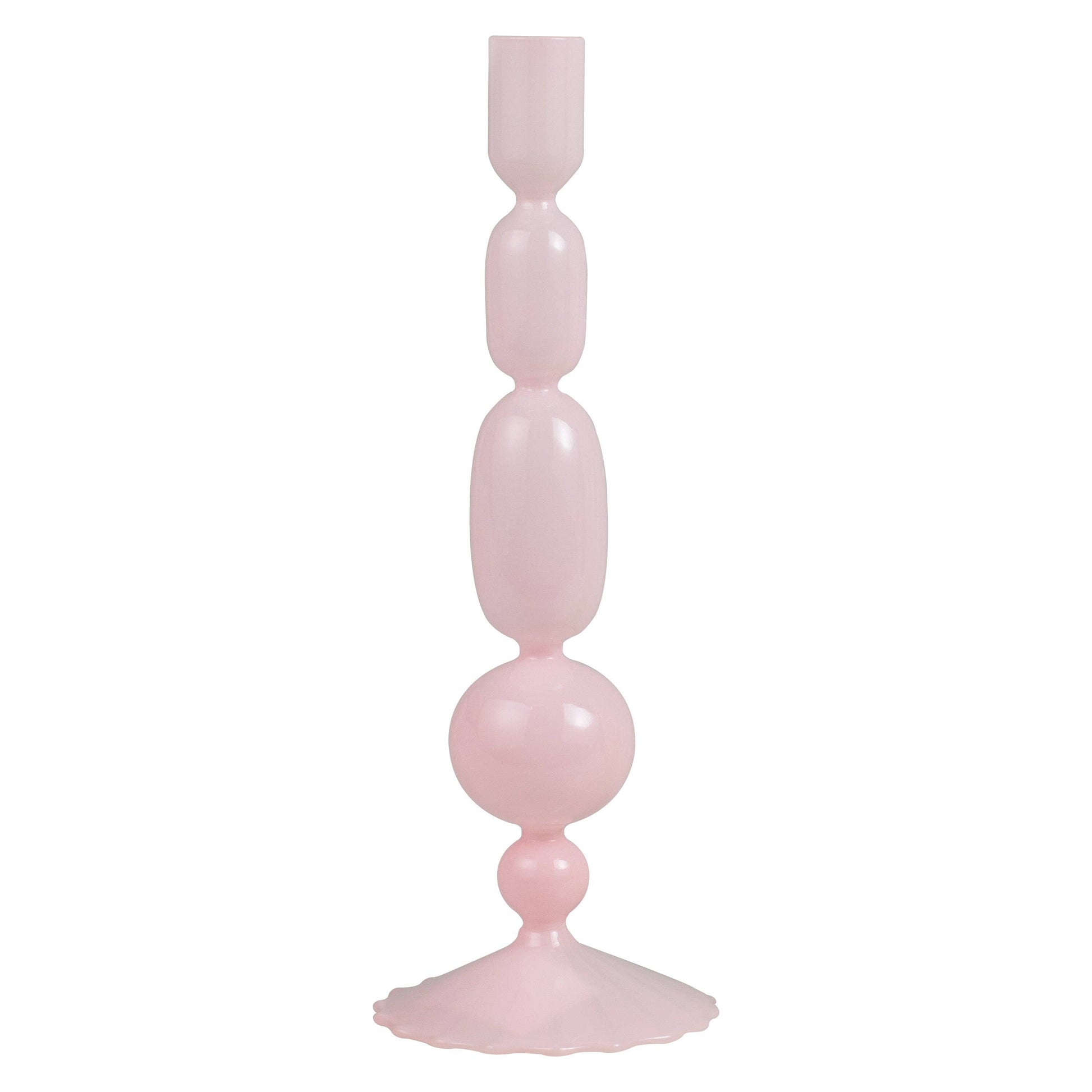 Pink glass candle holder with a decorative design on a white background