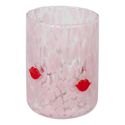 Pink marbled glass with red lip prints on a white background
