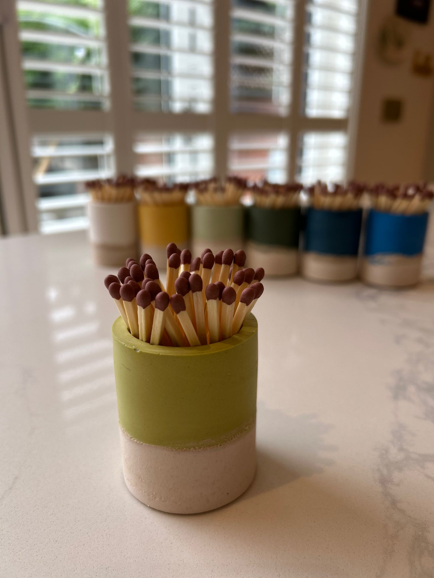 Two tone match pot with striker