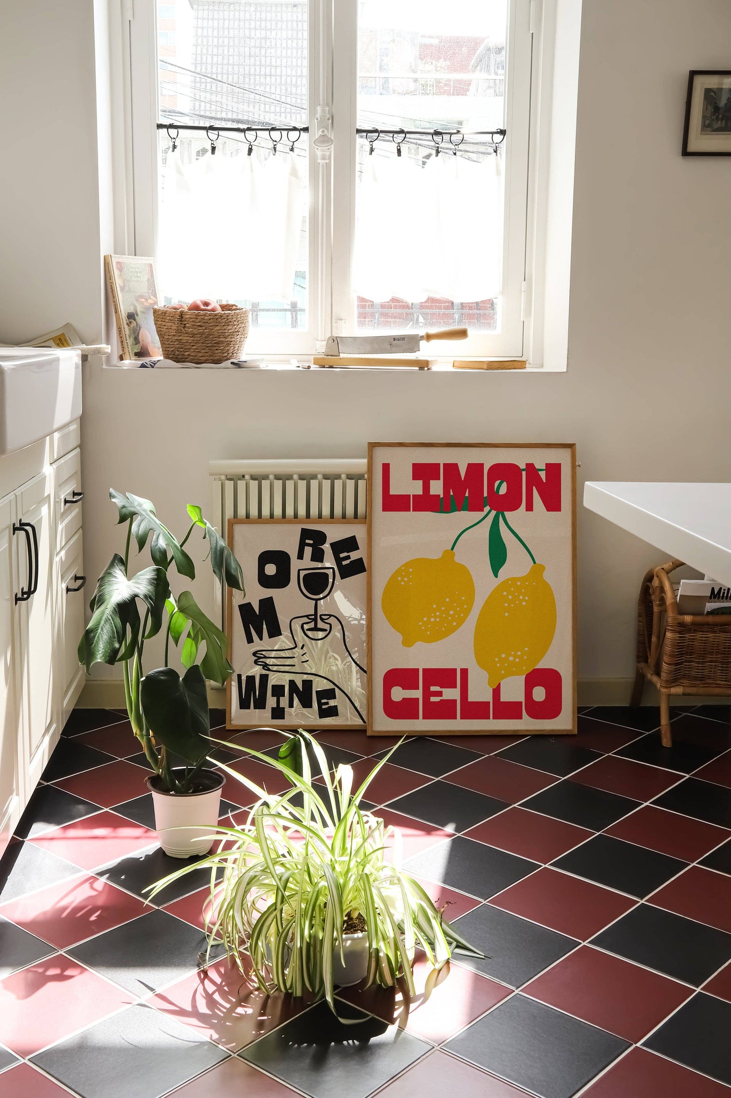Room interior with plants, posters, and a radiator on a tiled floor.