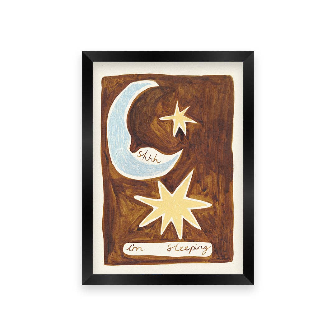 Framed artwork with moon, star, and text on a white background