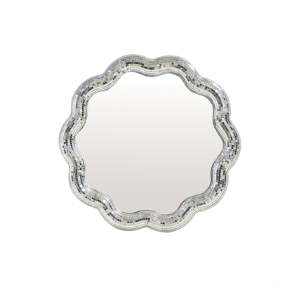 Decorative round mirror with a scalloped edge and mosaic border on a white background