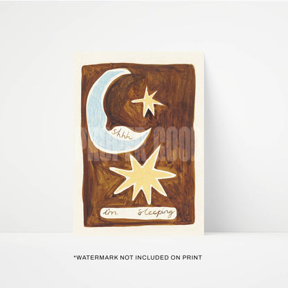 Wooden sign with moon and star design on a white background