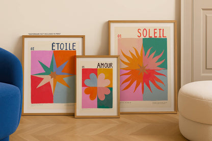 Three framed abstract artworks with text on a wall in a room.