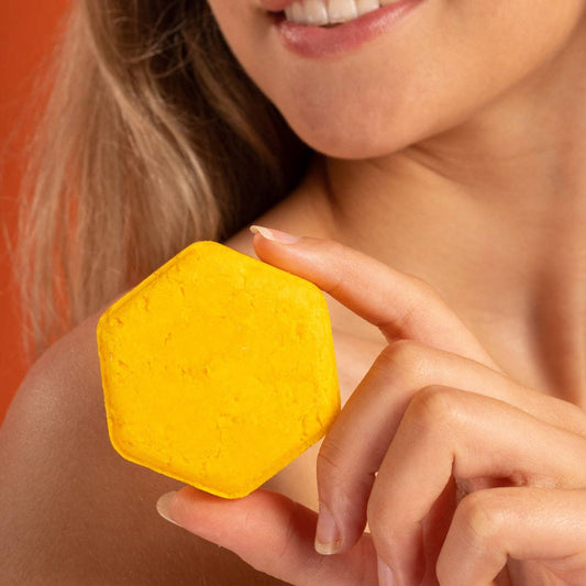 Tangerine Sunshine Shower Bar in hand