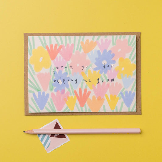 Colorful floral card with 'Thank you for helping me grow' text on a yellow background