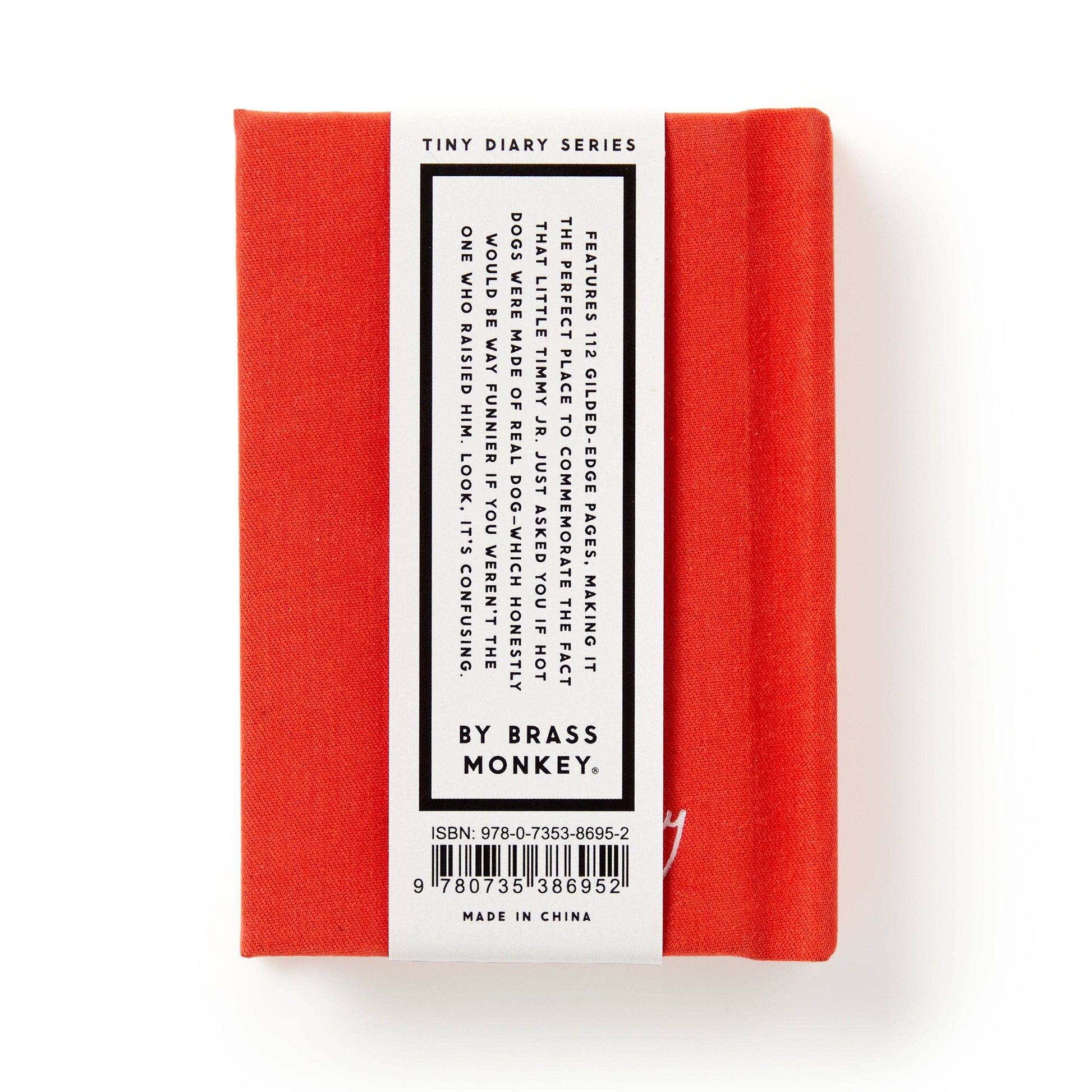 Red notebook with a white label on a white background