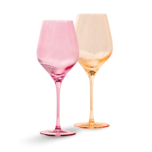 Two colorful wine glasses, one pink and one orange, on a white background