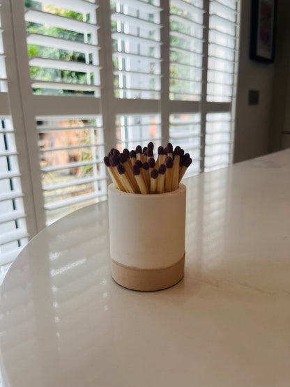Two tone match pot with striker
