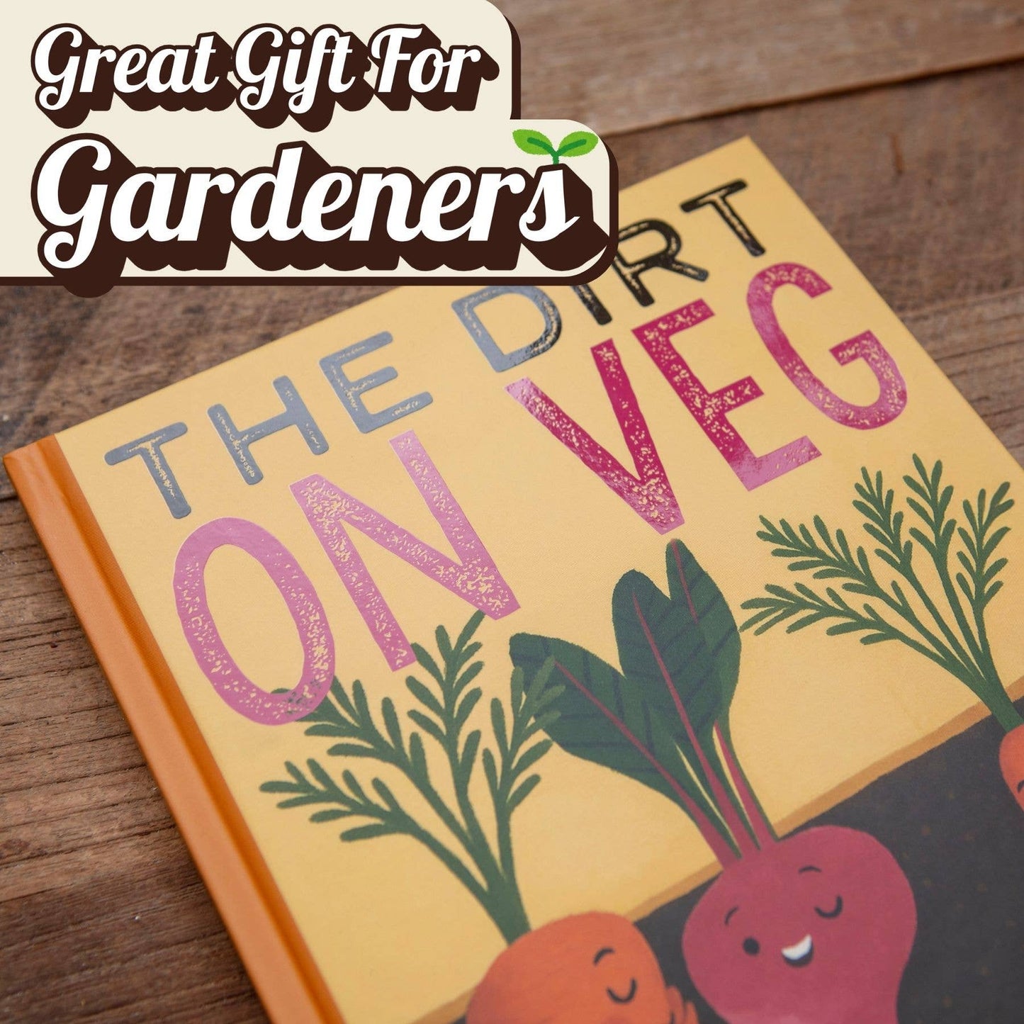 Book titled 'The Dirt on Veg' with cartoon vegetables on a wooden surface, labeled as a great gift for gardeners.
