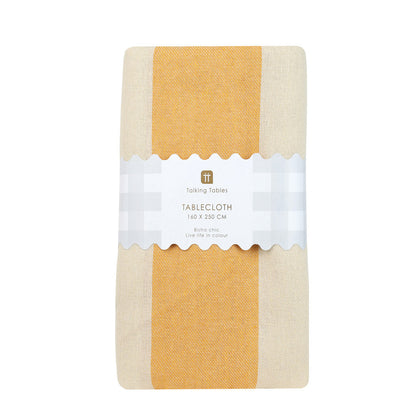 Packaged tablecloth with a yellow and beige design on a white background